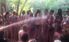 Big beach party where they're having a fun wet T-shirt cont