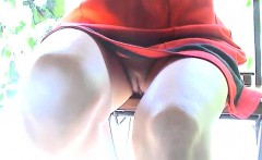 Naughty Chick Lets You See Up Her Skirt While Not Wearing P