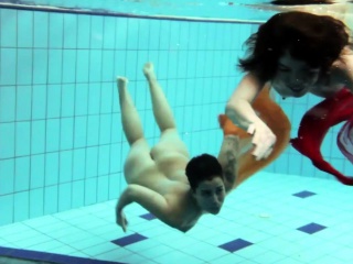 Two underwater girls loving eachother