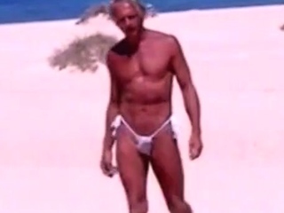 Tanned guy on beach in tiny string thong (temporarily!)