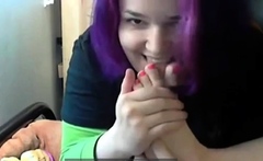 Goth emo girl licks her own feet