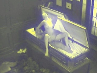 Couple Fucking in Coffin