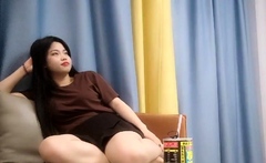 Cute amateur asian web cam girl playing with her toy