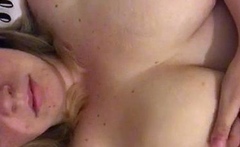 Busty curly brunette with big boobs fucks on couch