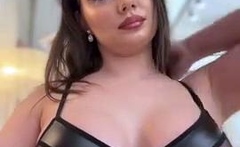 Busty babe playing with her big boobs